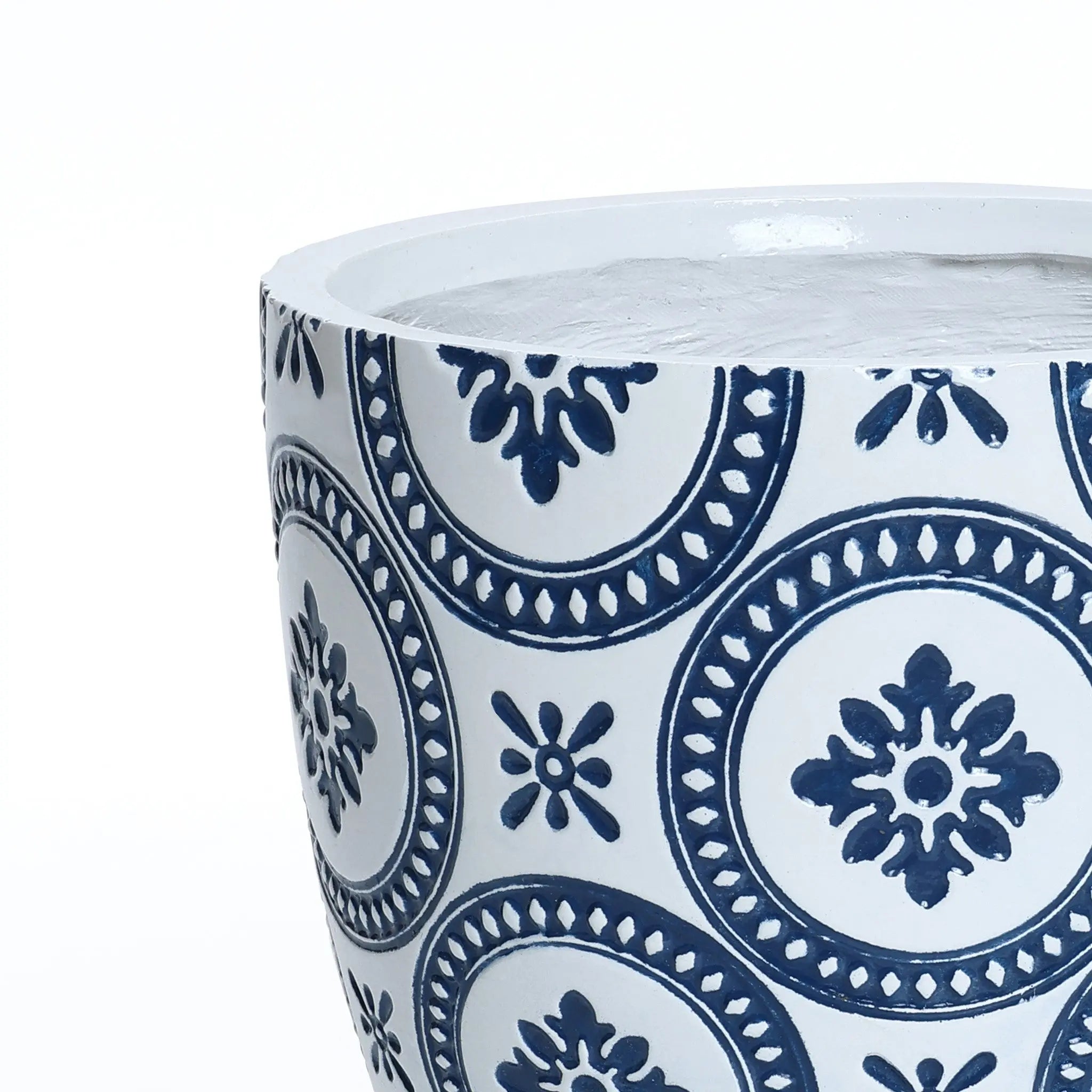 Close-up of a modern planter crafted with MgO material, featuring blue circular and floral patterns on a white background.