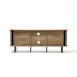 The Aria oak finish TV stand by LuxenHome, designed for TVs up to 55 inches, features a minimalist mid-century modern style with three sliding doors and circular cutouts. Elevated on black metal legs, it offers enclosed storage. The image showcases it on a clean, white background.