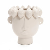 The LuxenHome white ceramic bust head vase, 9.6 high, is a modern planter shaped like a face with minimal features including a nose, lips, and ears. It features lemon-like shapes adorning its sculpted head design.