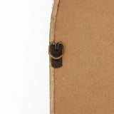 Close-up of a D-ring hanger attached to the back of a wooden frame, reminiscent of an arched silhouette, on a white background.