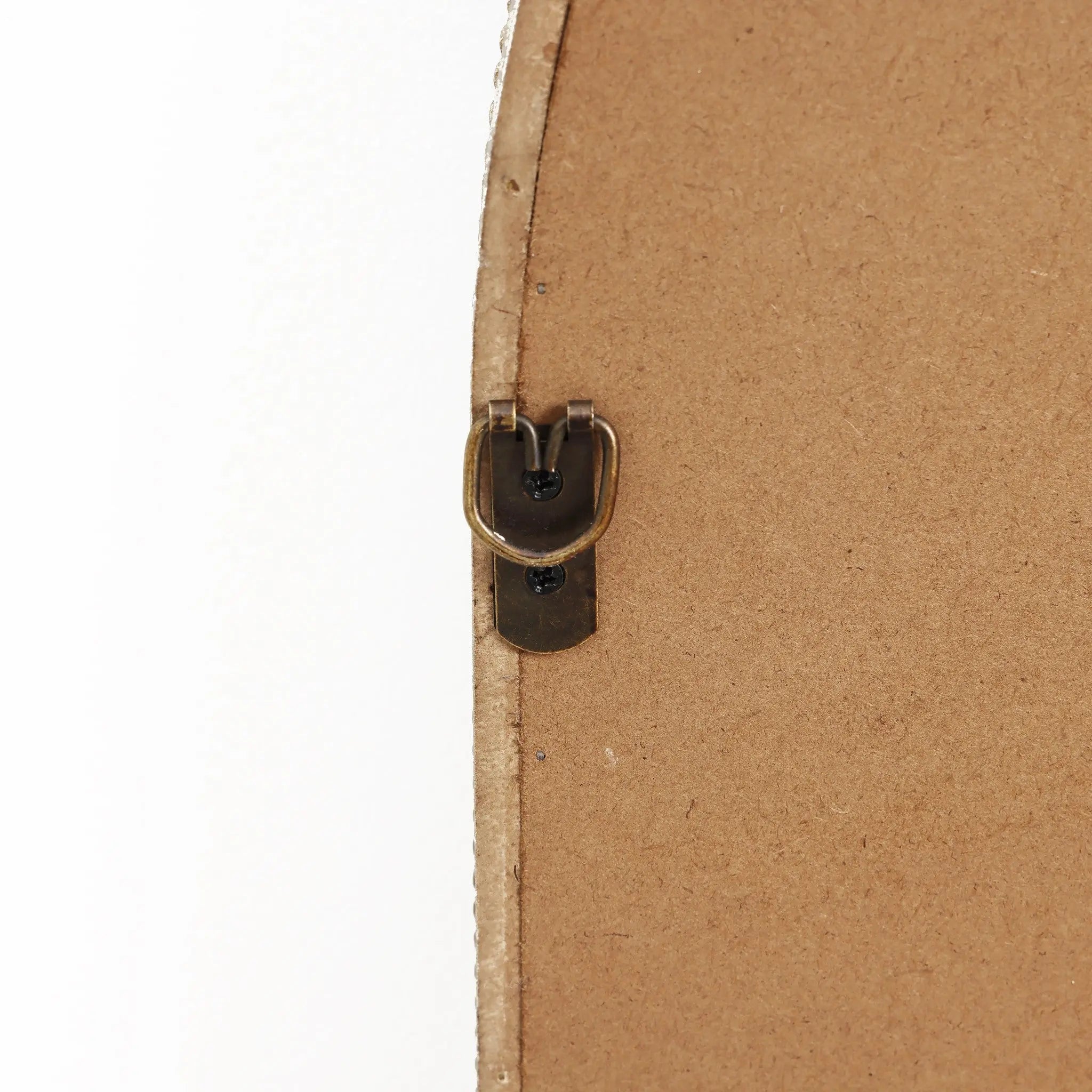 Close-up of a D-ring hanger attached to the back of a wooden frame, reminiscent of an arched silhouette, on a white background.