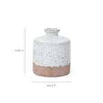 A small ceramic vase with a white and terracotta finish features a bottle-like design. This two-tone ceramic vase stands 7.09 inches tall and has a diameter of 6.3 inches, adding charm to any space.