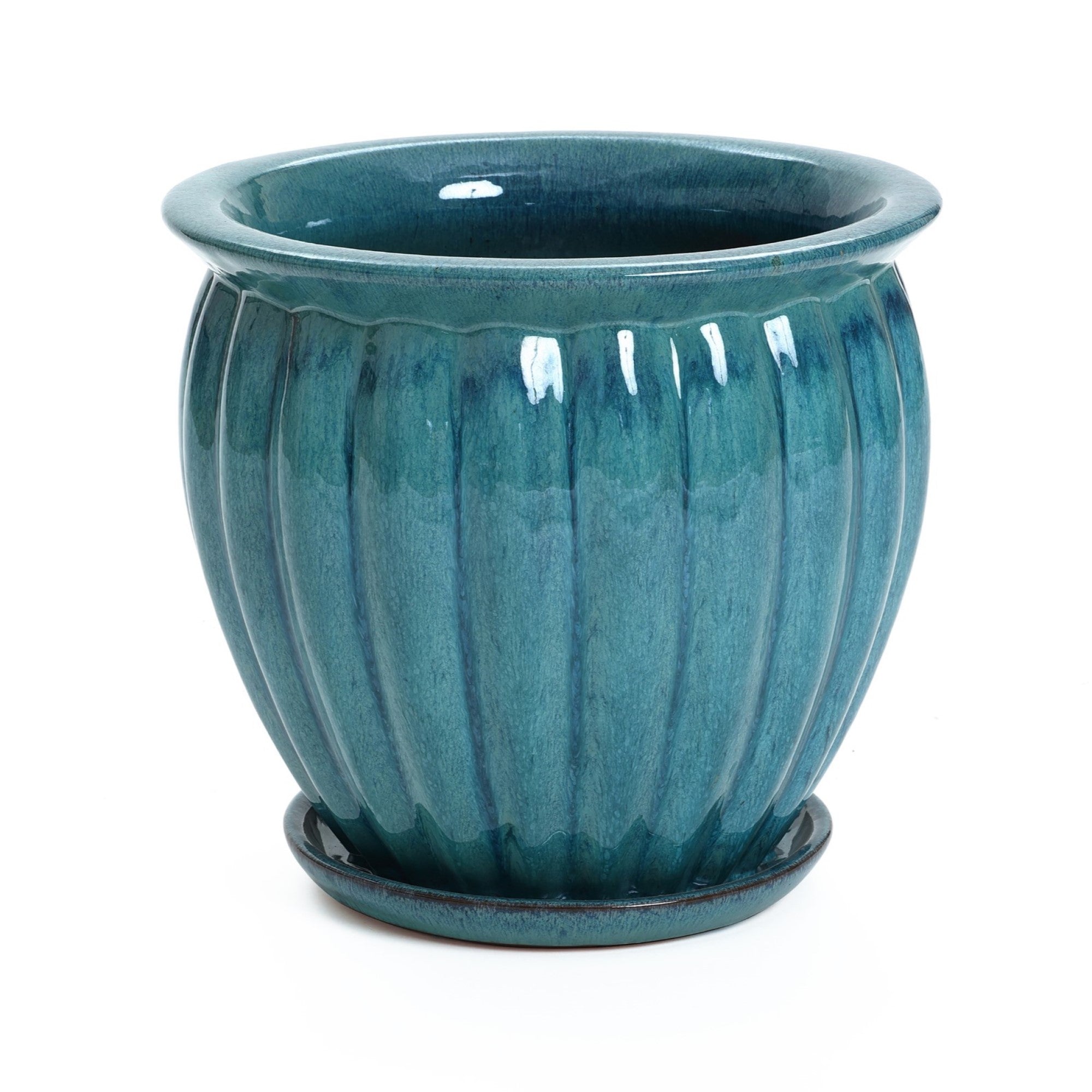 A glossy ceramic decorative planter with vertical ridges, finished in a navy blue glaze, comes complete with drainage holes and a matching saucer underneath.