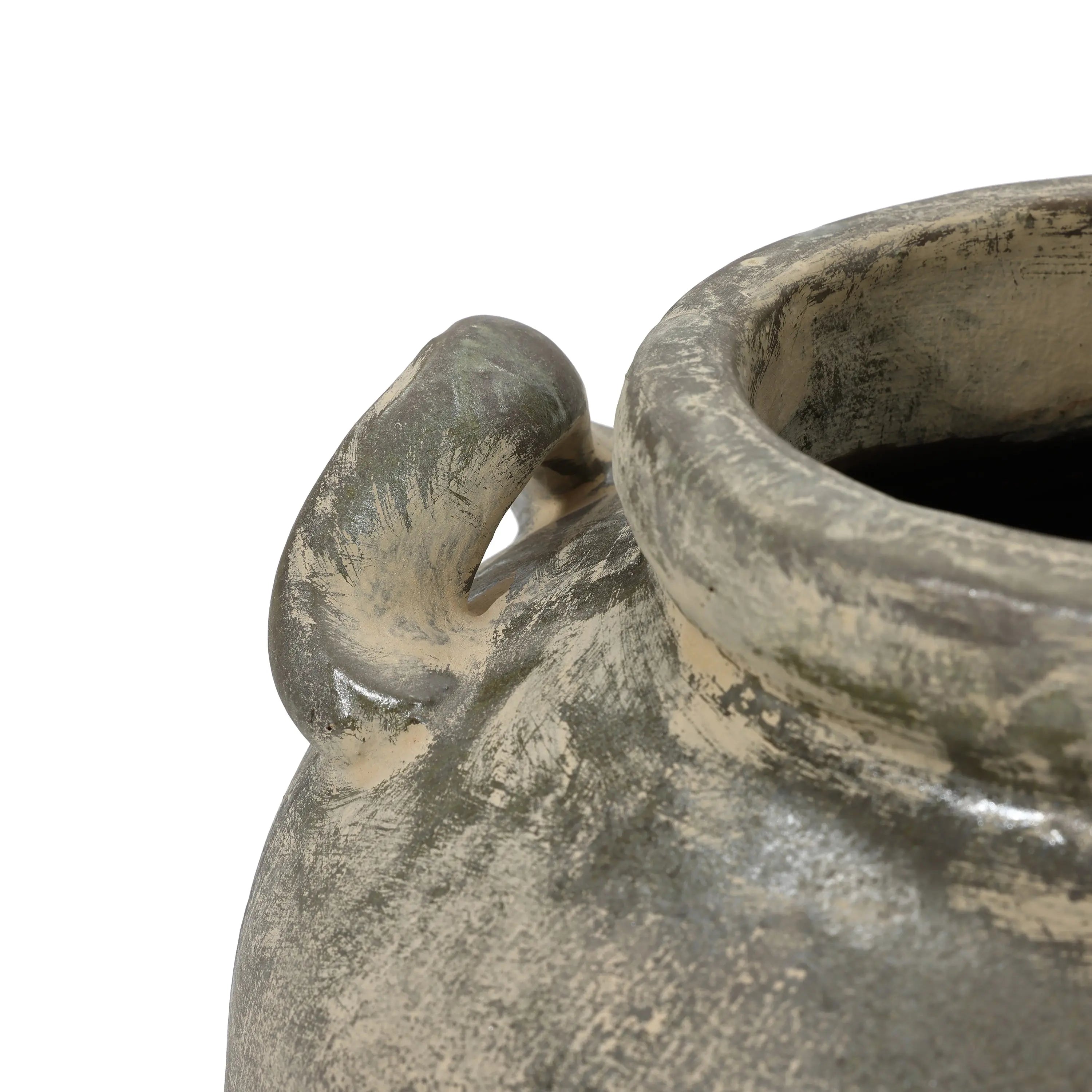 Close-up of the Fou antique terracotta vase by LuxenHome, featuring an aged, rustic grayish-brown finish and rough texture. The handcrafted piece highlights its lip and curved handle against a plain white background.