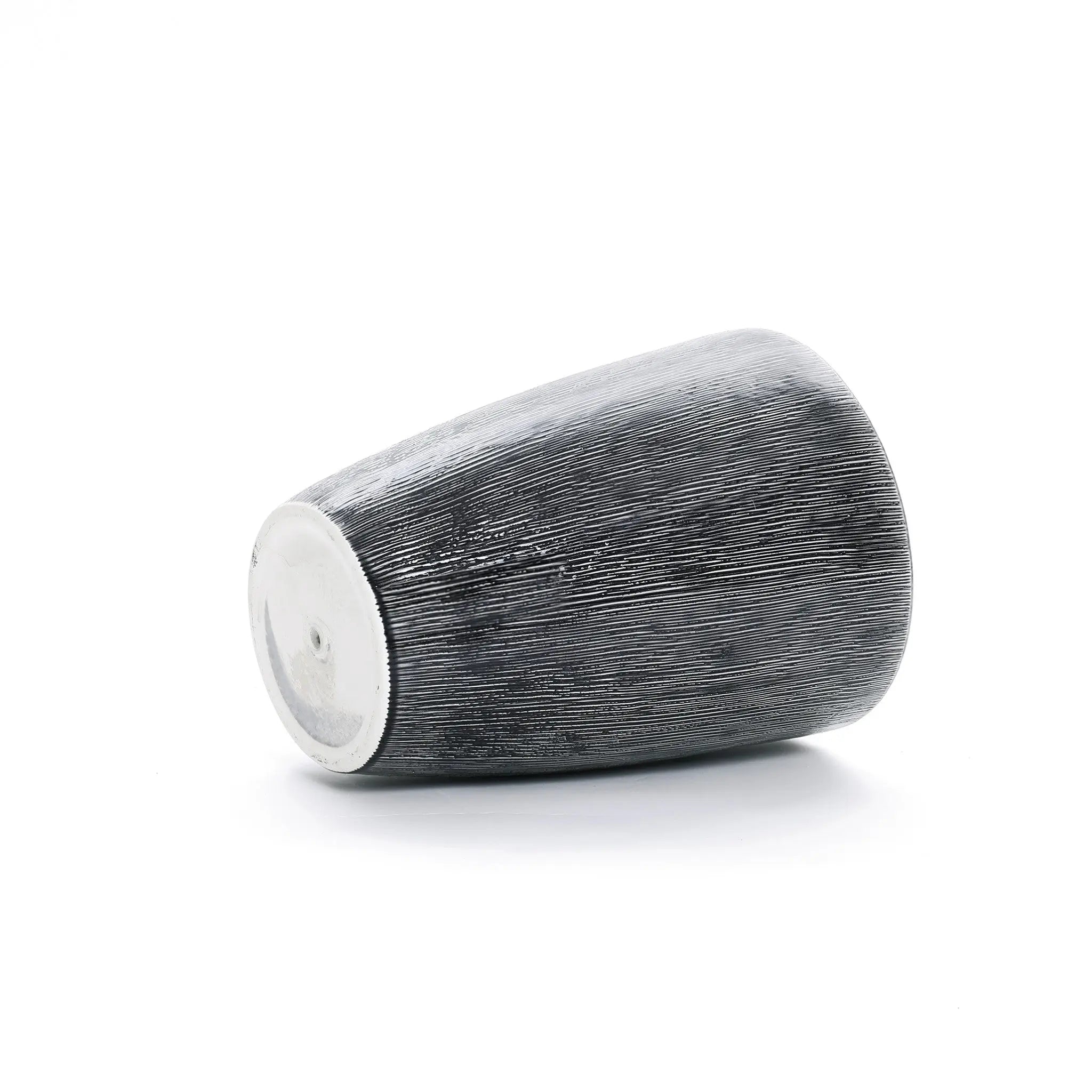 A LuxenHome Sea Gray Ripples glazed ceramic planter, 17 tall, features a textured dark gray design with subtle black-and-white vertical stripes and horizontal lines. It rests on a smooth, rounded base against a plain white background, completing its elegant look.