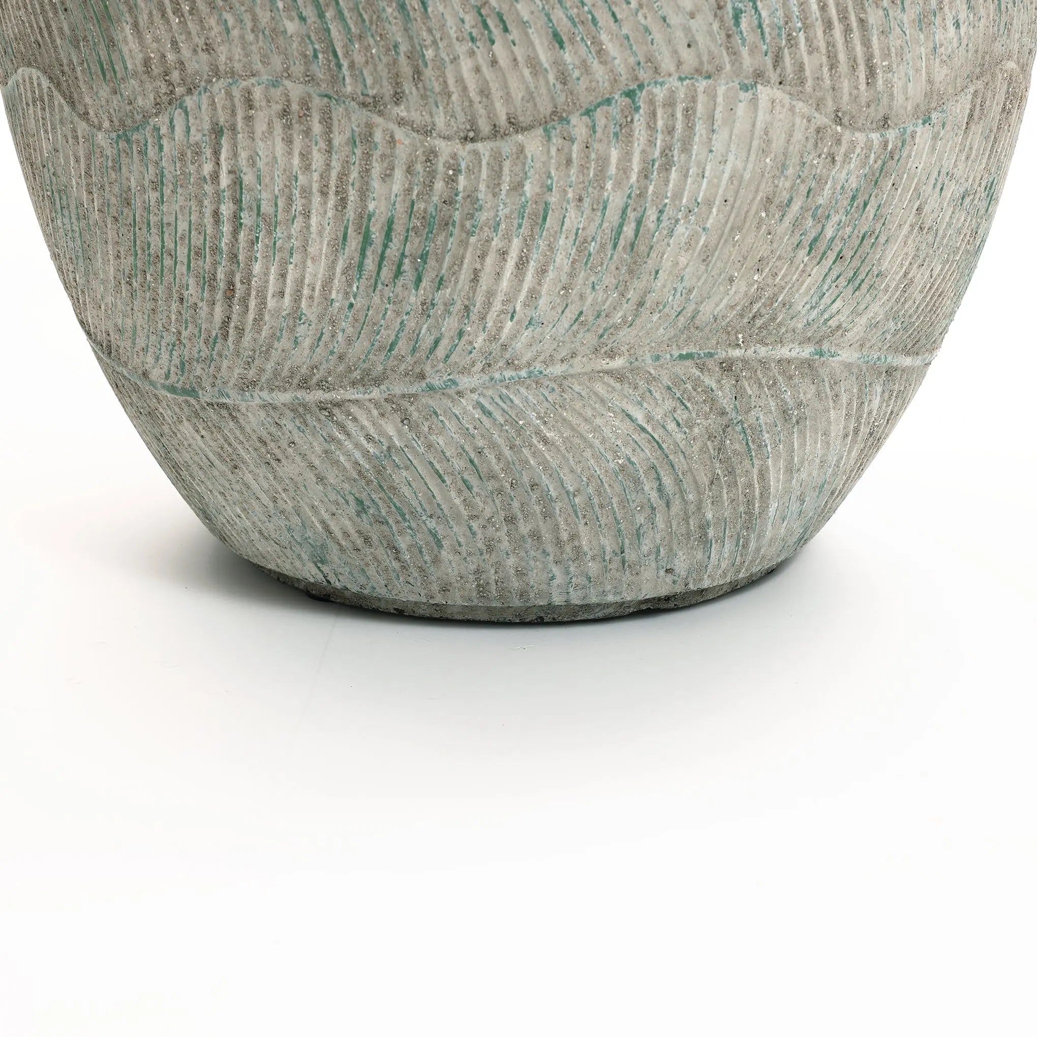 A close-up of the Rustic Multi-Color Cement 15.4-Inch Round Planter by LuxenHome showcases its textured ceramic design with wavy patterns and a subtle greenish hue, reminiscent of rustic charm, against a plain white background.