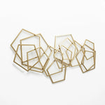 Abstract shapes wall decor with intertwining golden frames on a white background creates stunning geometric metal wall art.