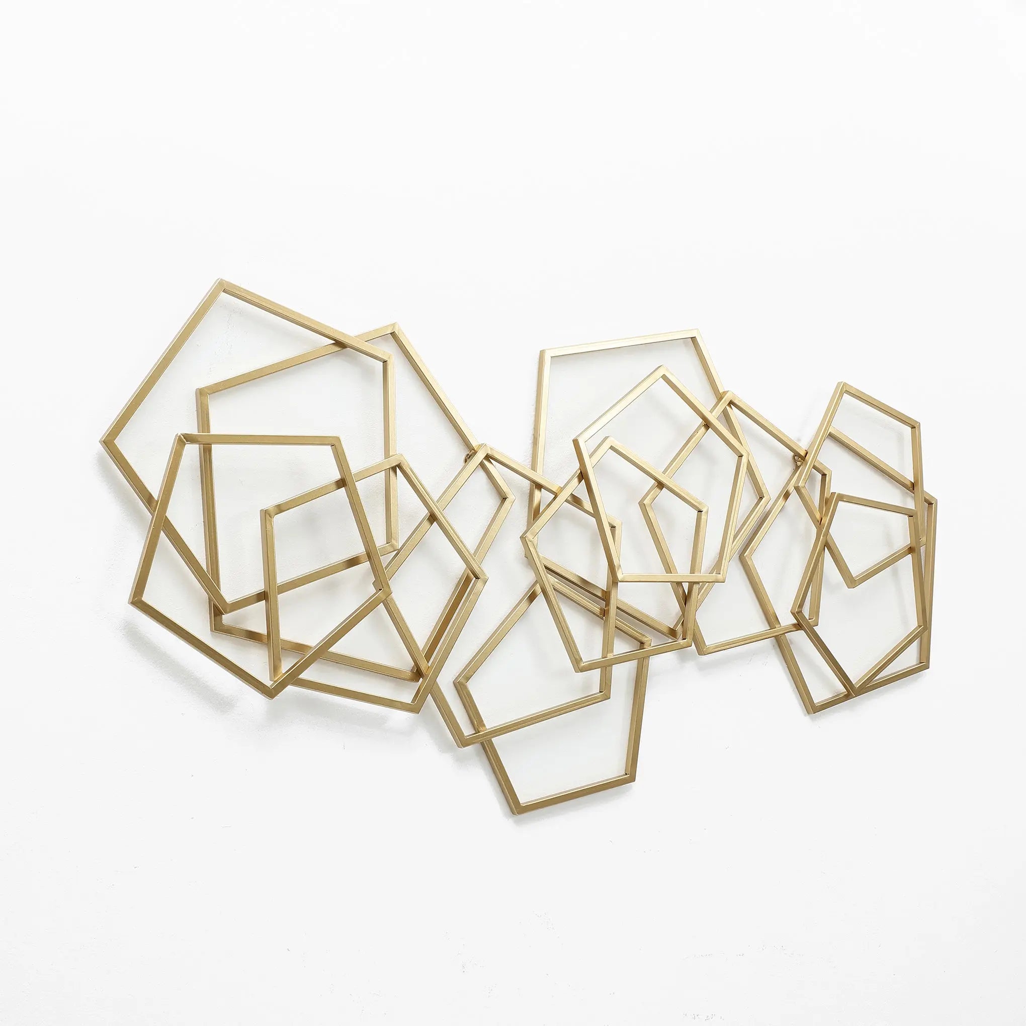 Abstract shapes wall decor with intertwining golden frames on a white background creates stunning geometric metal wall art.