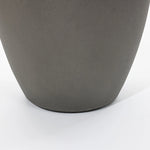 Close-up of a gray, smooth-surfaced planter on a white background, part of a modern planter set.