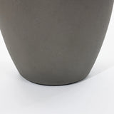 Close-up of a gray, smooth-surfaced planter on a white background, part of a modern planter set.