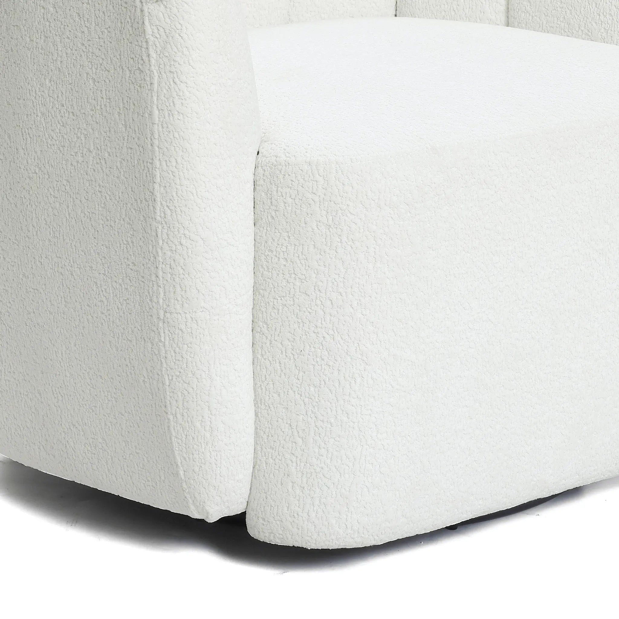 Close-up of the LuxenHome Amber ivory boucle swivel barrel accent chair, showcasing its modern, minimalist design in soft boucle fabric. Focus on seat corner and backrest to highlight elegant contours.
