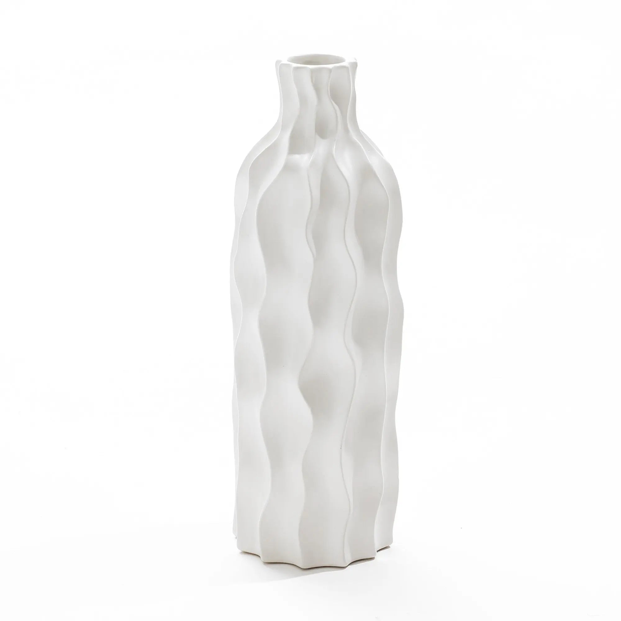 A tall, white, wavy ceramic vase stands on a plain background, showcasing its elegant design as a versatile piece that complements any decor.