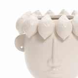The LuxenHome White Ceramic Bust Head Vase, 9.6 h, showcases a sculpted modern head design with a white ceramic face adorned by a row of lemon-like hair motifs against a plain background.