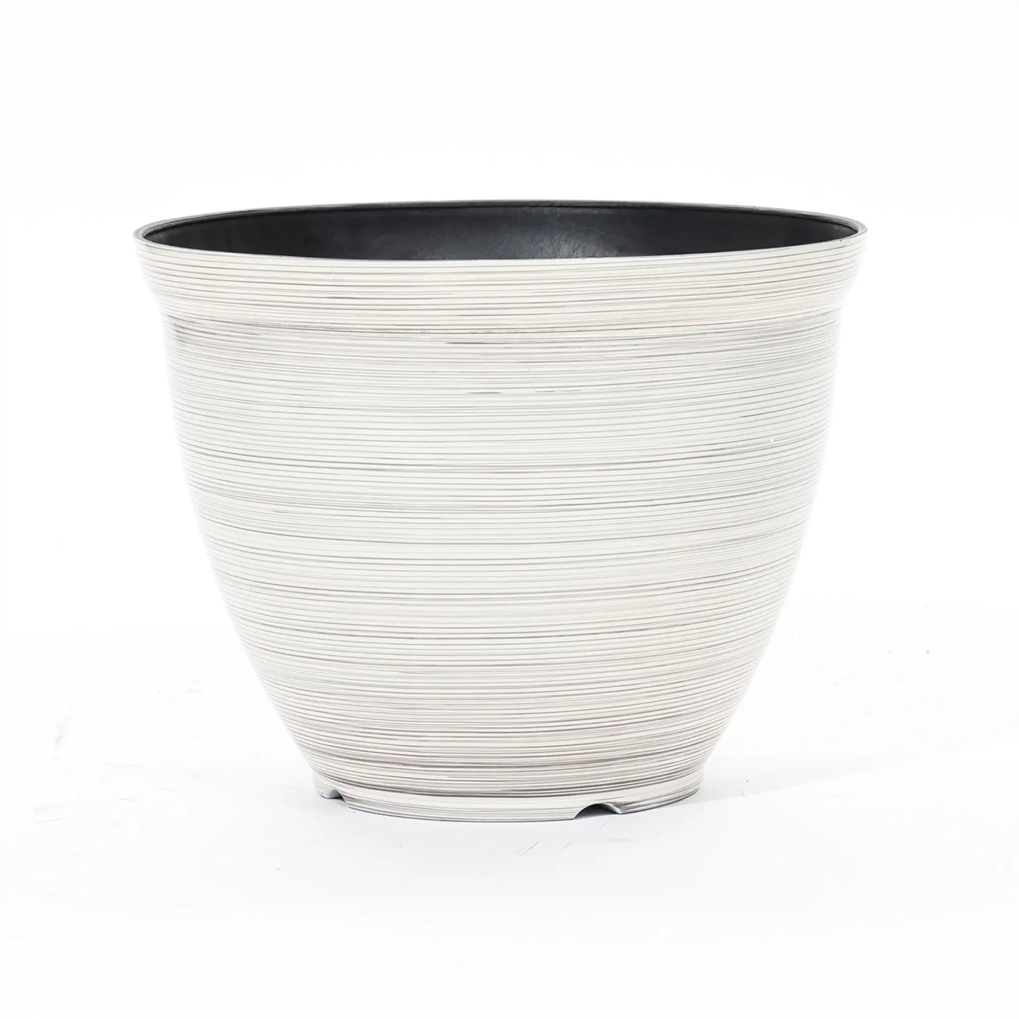A contemporary planter with a round, ribbed design features a durable plastic construction. This striking piece boasts a black interior and white exterior, set against a plain background.