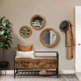 A hallway with a rubberwood framed bench, three circular mirrors creating an optical illusion, a hat, a coat, and a plant.