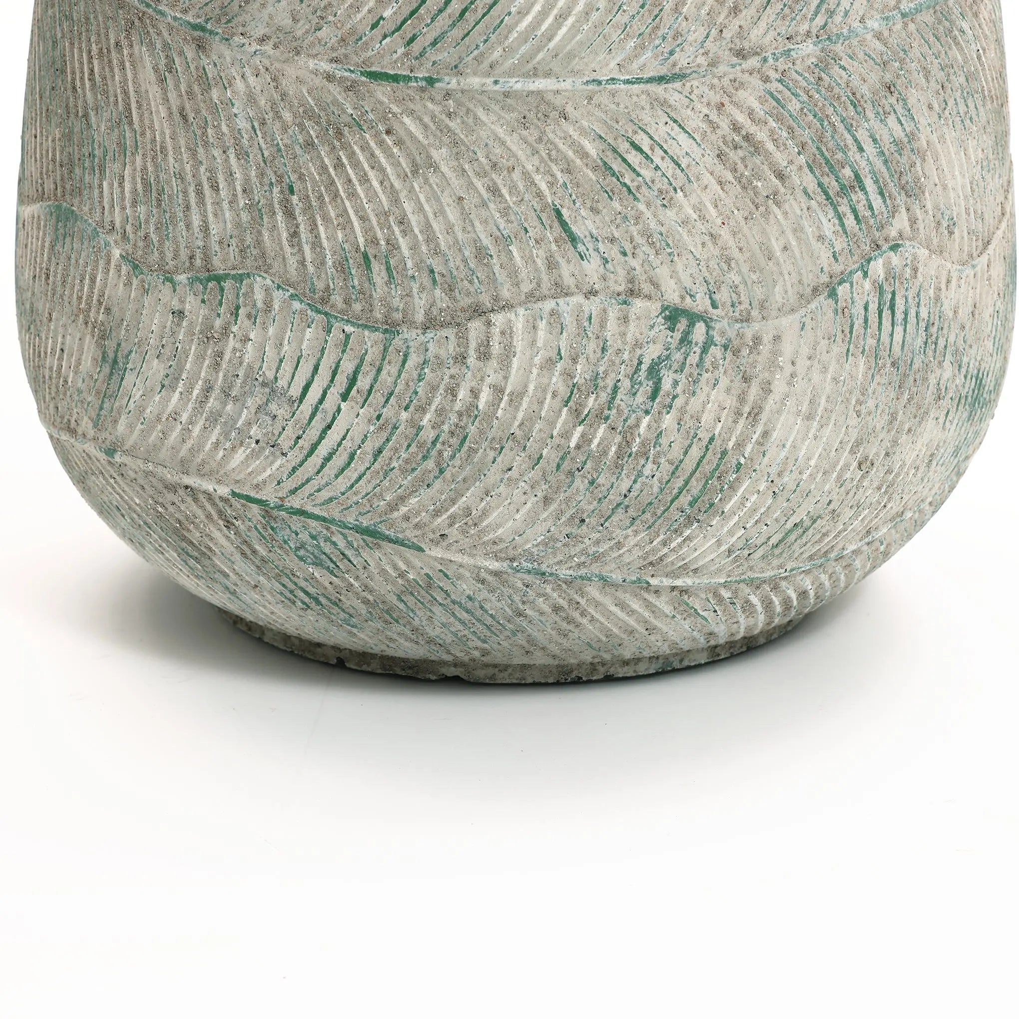 Close-up of the textured surface of the Rustic Multi-Color Cement 18.3-Inch Round Planter by LuxenHome. It features a wavy pattern with green accents on its gray surface, offering an artistic look against a plain white background.