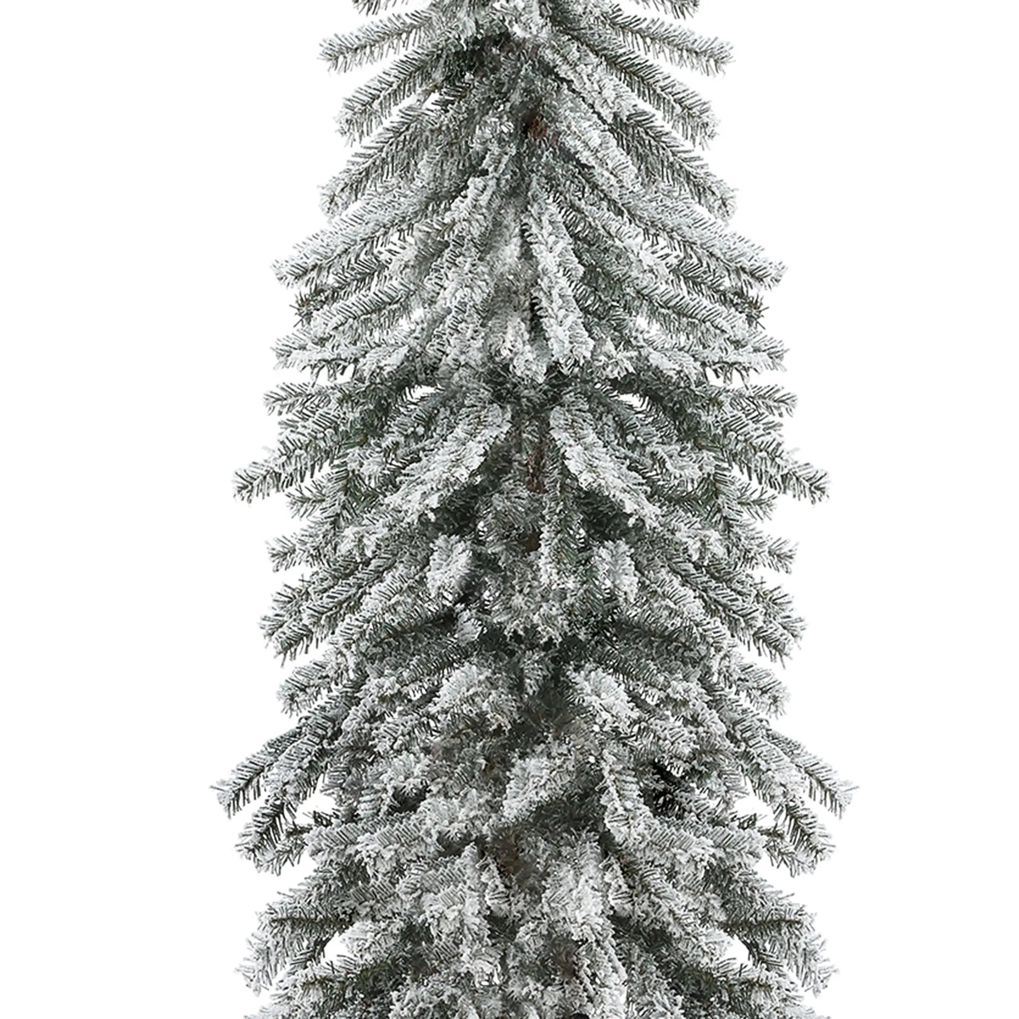 A close-up view of a tall, artificial Christmas tree with lifelike PVC branches and snow-frosted tips, set against a white background for a true winter wonderland feel.