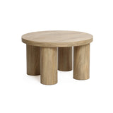 This contemporary design coffee table features a round, flat surface crafted from manufactured wood, supported by four cylindrical legs with an elegant oak finish.