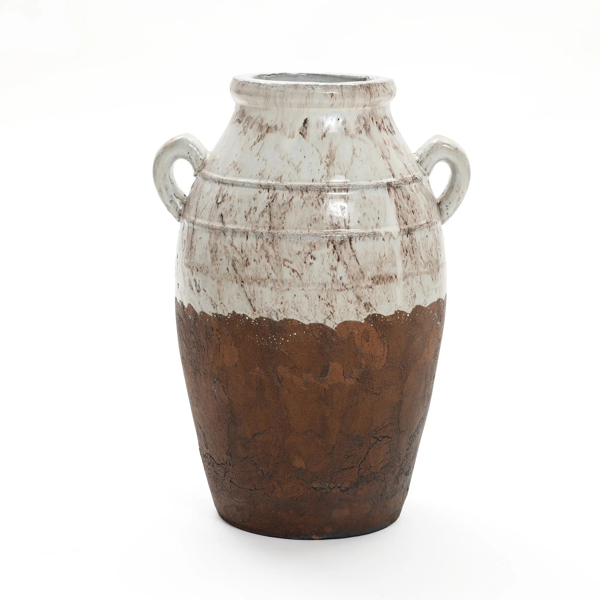 The Rustic cream and brown terracotta urn vase with handles by LuxenHome is 18.5 high, combining rustic elegance with a speckled white upper and textured dark brown lower section, showcasing true artisanal craftsmanship.