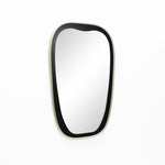 A contemporary mirror with an oblong shape and a thin, black frame beautifully adorns the white wall.