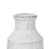A close-up of the top portion of a white ceramic vase with a slightly textured surface and narrow neck, exuding rustic charm.
