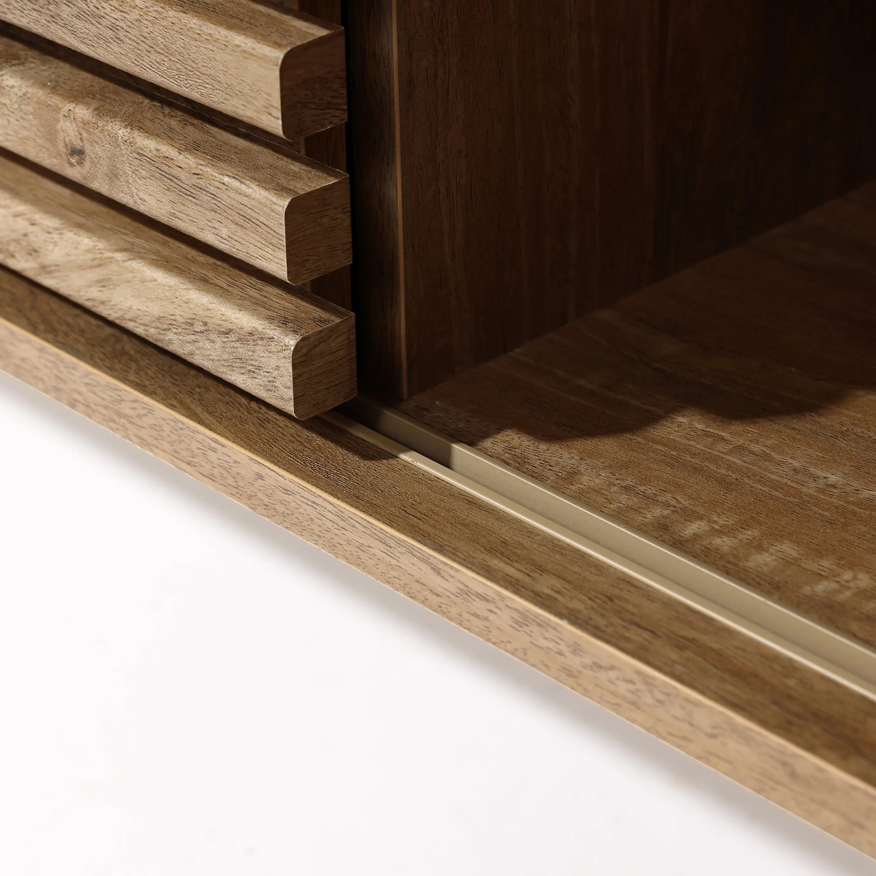 Close-up of a wooden cabinet featuring a sliding door mechanism on a metal track, offering dual-side storage. The edges and grain of the wood are beautifully visible.