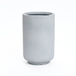 Gray, cylindrical ceramic vase with a smooth, matte finish on a white background, perfect for modern minimalist decor.