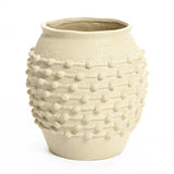 A boho planter featuring textured detailing and raised circular patterns around the middle section, perfect for adding charm to your outdoor space.