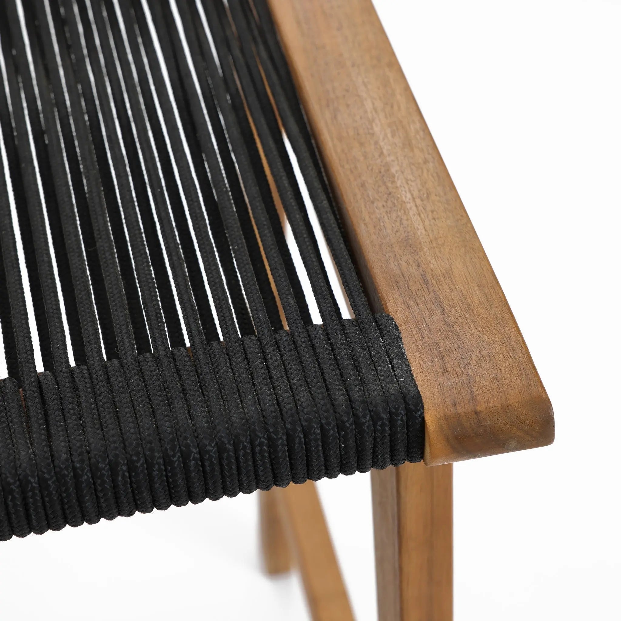 Close-up of a chair seat featuring FSC-certified acacia wood in its frame, complemented by a black woven cord design.