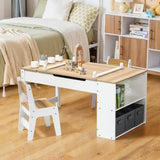 Activity Children Table with Storage Bookcase and 2 Chairs Set featuring a white and natural wood design with built-in storage shelves, paper clamps, paint pot holders, and adjustable height tabletop, shown in a cozy bedroom setting with matching white chairs and storage boxes.