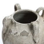 A close-up of the Rustic gray and white terracotta vase with handles by LuxenHome, measuring 11 in height. This piece showcases a weathered surface with three curved handles, blending contemporary elegance with its antiqued texture.