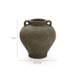 The LuxenHome Rustic Brown Terracotta Cauldron Vase, standing 14.6 inches tall with a 13.8-inch diameter, features an ancient earthy texture and two handles near the rim. Its a perfect piece of natural elegance for home decor.