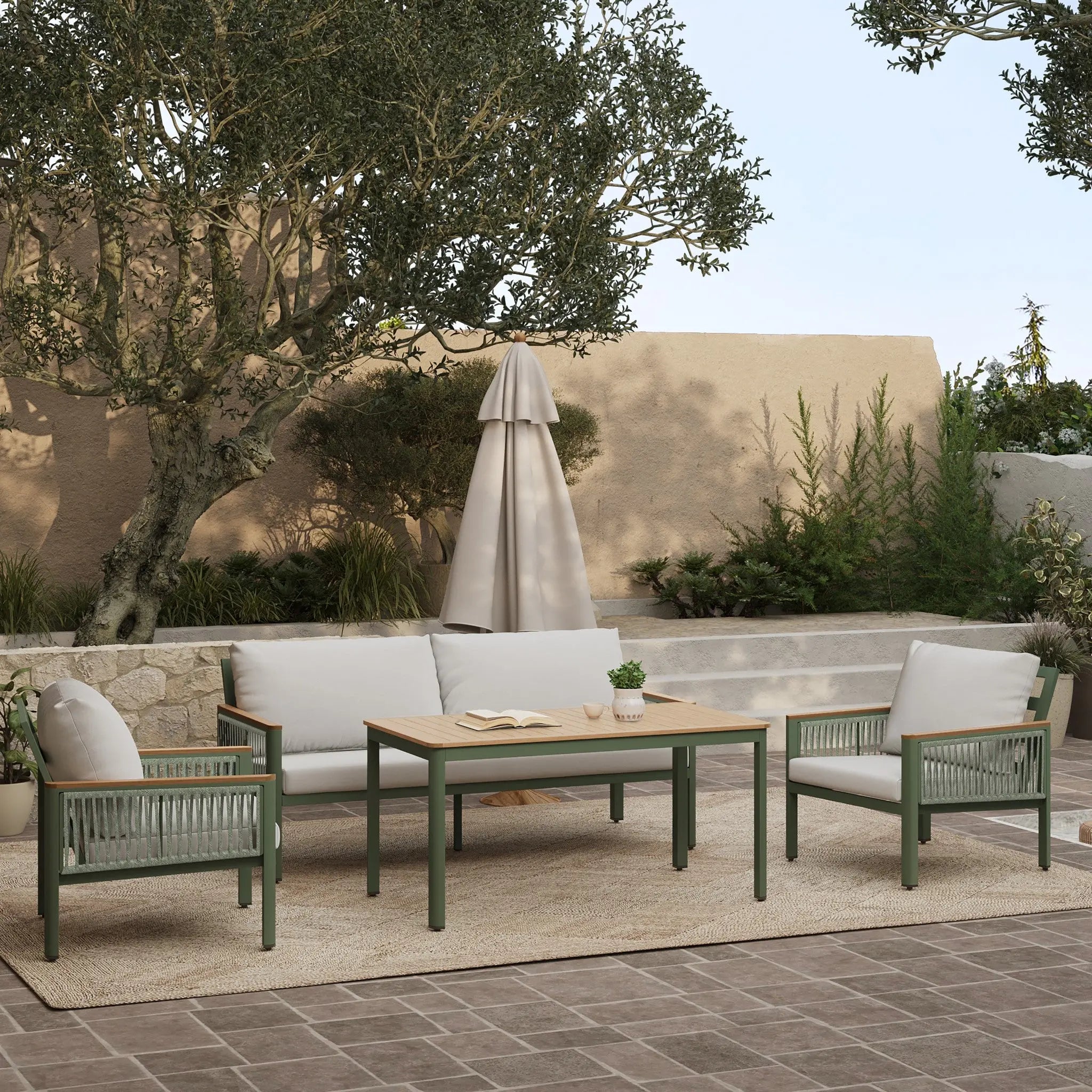 Outdoor patio with a three-seater sofa featuring plush cushions, two armchairs, and a wooden coffee table on a rug. Theres an umbrella and trees in the background, with beige walls and greenery surrounding the area—all set around a durable aluminum alloy frame for lasting elegance.