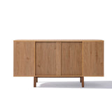 The LuxenHome Miko sideboard server cabinet has a minimalist mid-century modern design with a light oak finish, featuring two sliding doors and four spacious compartments. Its sleek structure stands on solid wood legs, making it an ideal storage piece for various interiors.