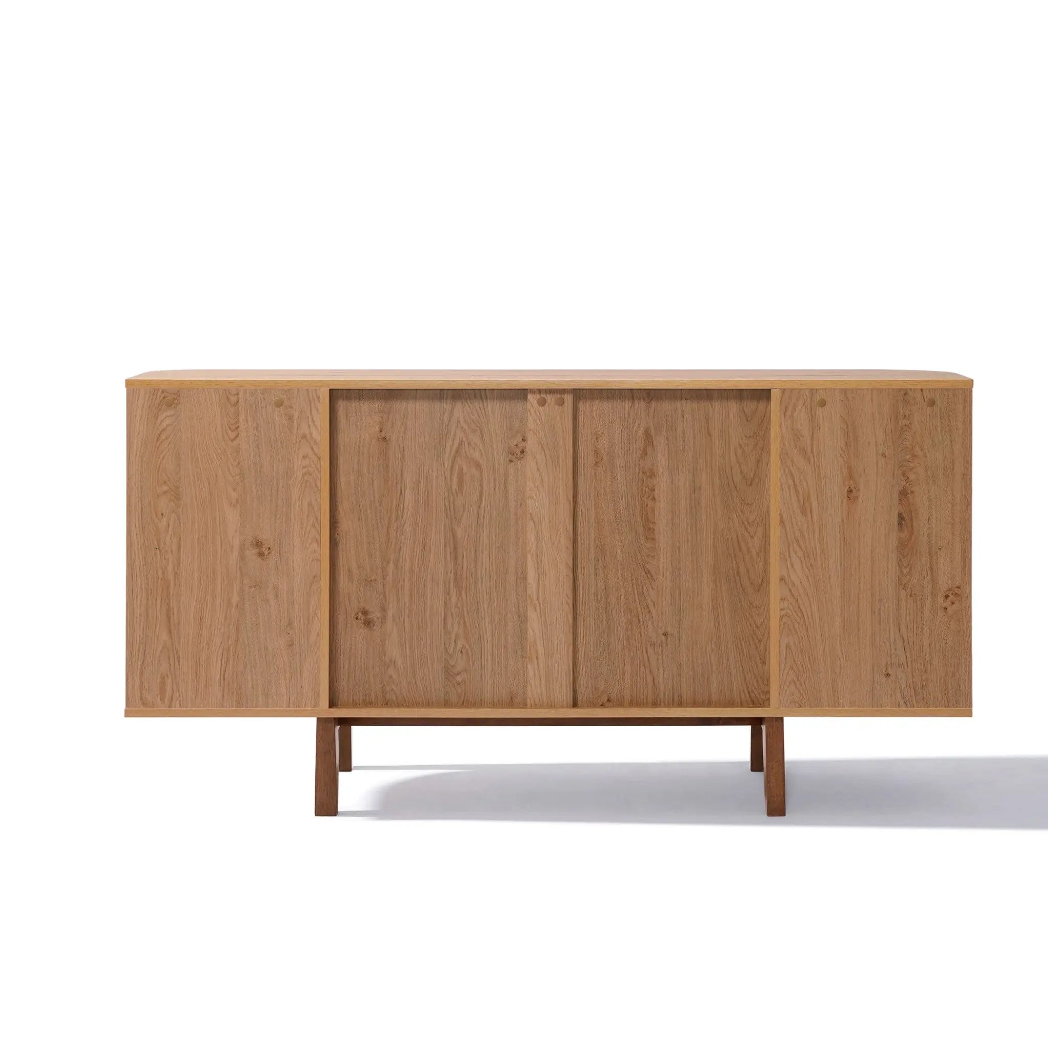 The LuxenHome Miko sideboard server cabinet has a minimalist mid-century modern design with a light oak finish, featuring two sliding doors and four spacious compartments. Its sleek structure stands on solid wood legs, making it an ideal storage piece for various interiors.