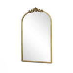 The LuxenHome Rêverie vintage gold accent mirror features an ornate metal frame with intricate detailing, resembling an arched window silhouette, set against a plain white background.