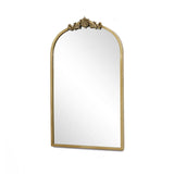 The LuxenHome Rêverie vintage gold accent mirror features an ornate metal frame with intricate detailing, resembling an arched window silhouette, set against a plain white background.