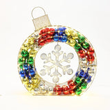 A festive Christmas wreath ornament shaped like a circular wreath, featuring colorful balls and a central snowflake design, perfect as an enchanting holiday decoration. Ideal for enhancing your outdoor lights display this season.