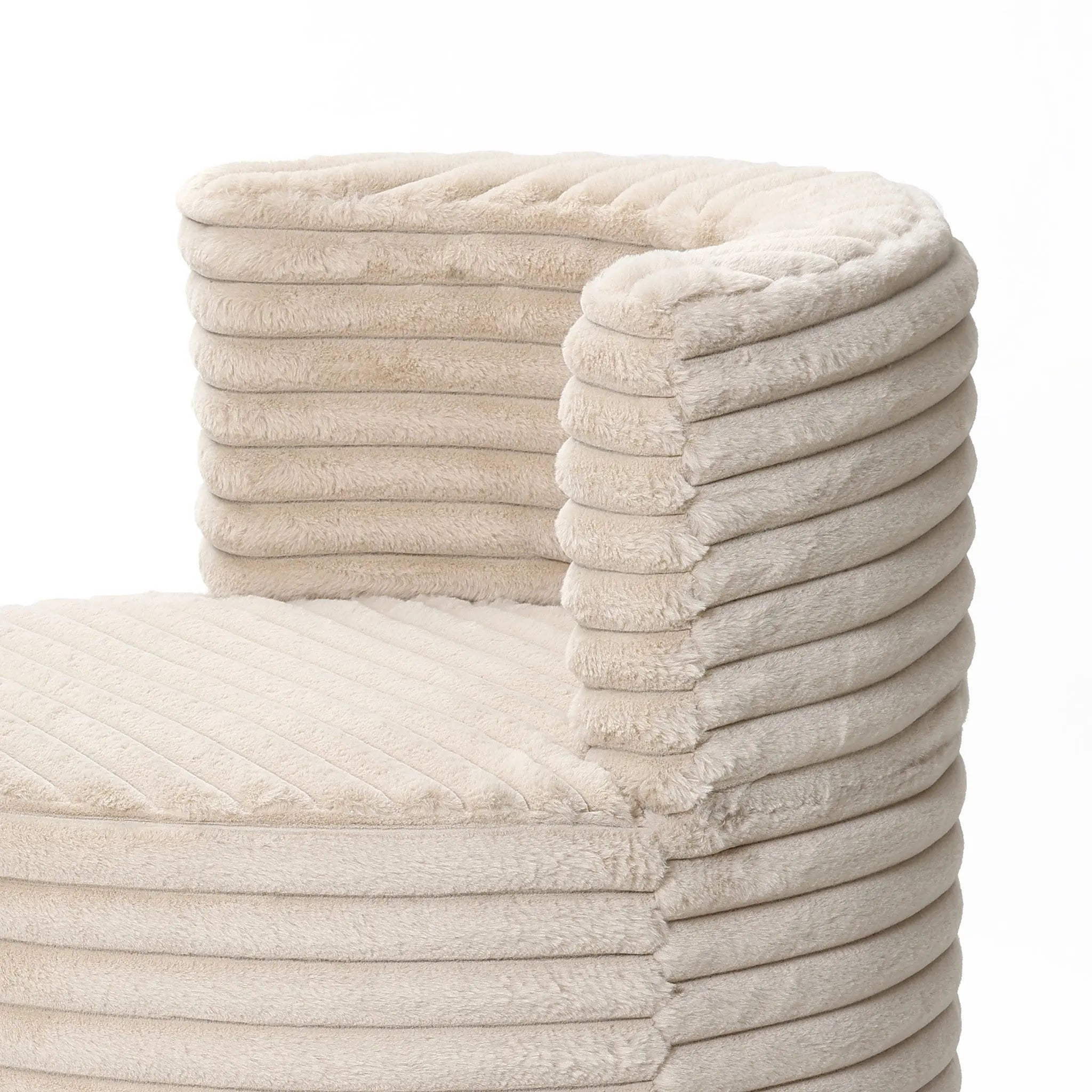 The Brie camel swivel barrel accent chair by LuxenHome features a cream-colored ribbed, curved backrest for a cozy contemporary look. The upholstered design, set against a white background, offers both style and comfort.