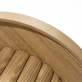 Close-up of a round wooden bench with curved slats and a smooth oak finish, showcasing its modern design.