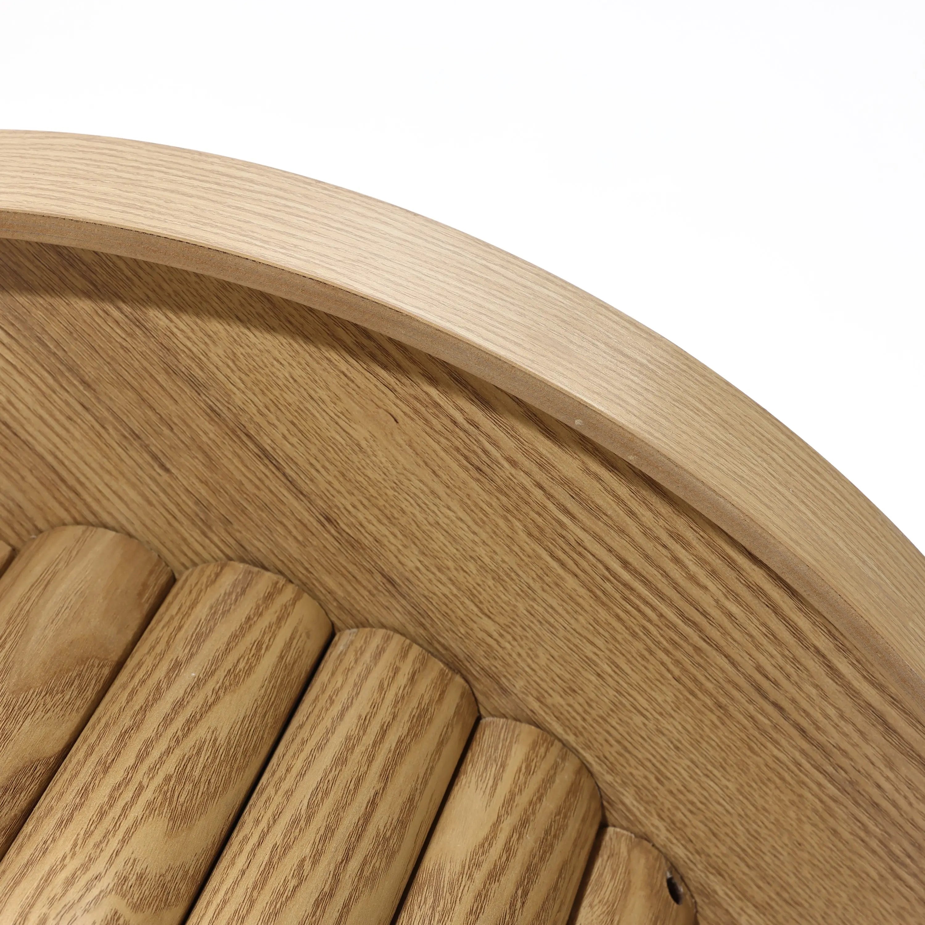 Close-up of a round wooden bench with curved slats and a smooth oak finish, showcasing its modern design.