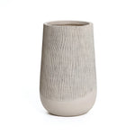 A tall vase showcases a natural wood pattern on its upper section, seamlessly transitioning to a smooth surface below. It embodies a modern minimalist aesthetic, perfect against the plain white background.