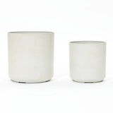 Two contemporary, cylindrical planters in light grey showcase a durable design. They vary in size and are set against a white background, embodying modern elegance.