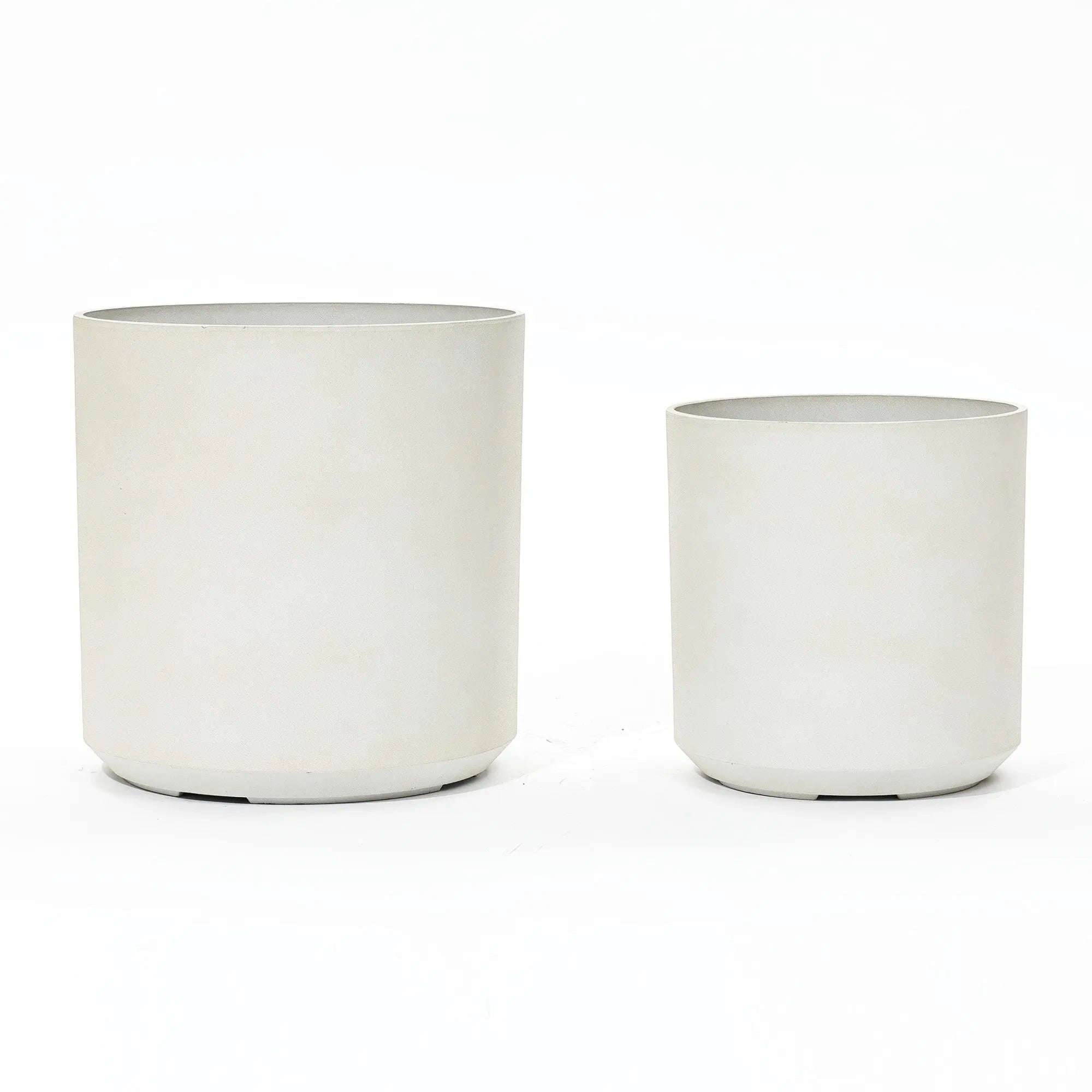 Two contemporary, cylindrical planters in light grey showcase a durable design. They vary in size and are set against a white background, embodying modern elegance.