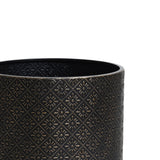 Elegant black cylindrical vase adorned with intricate diamond and star patterns, gracefully perched on a gold metal stand.
