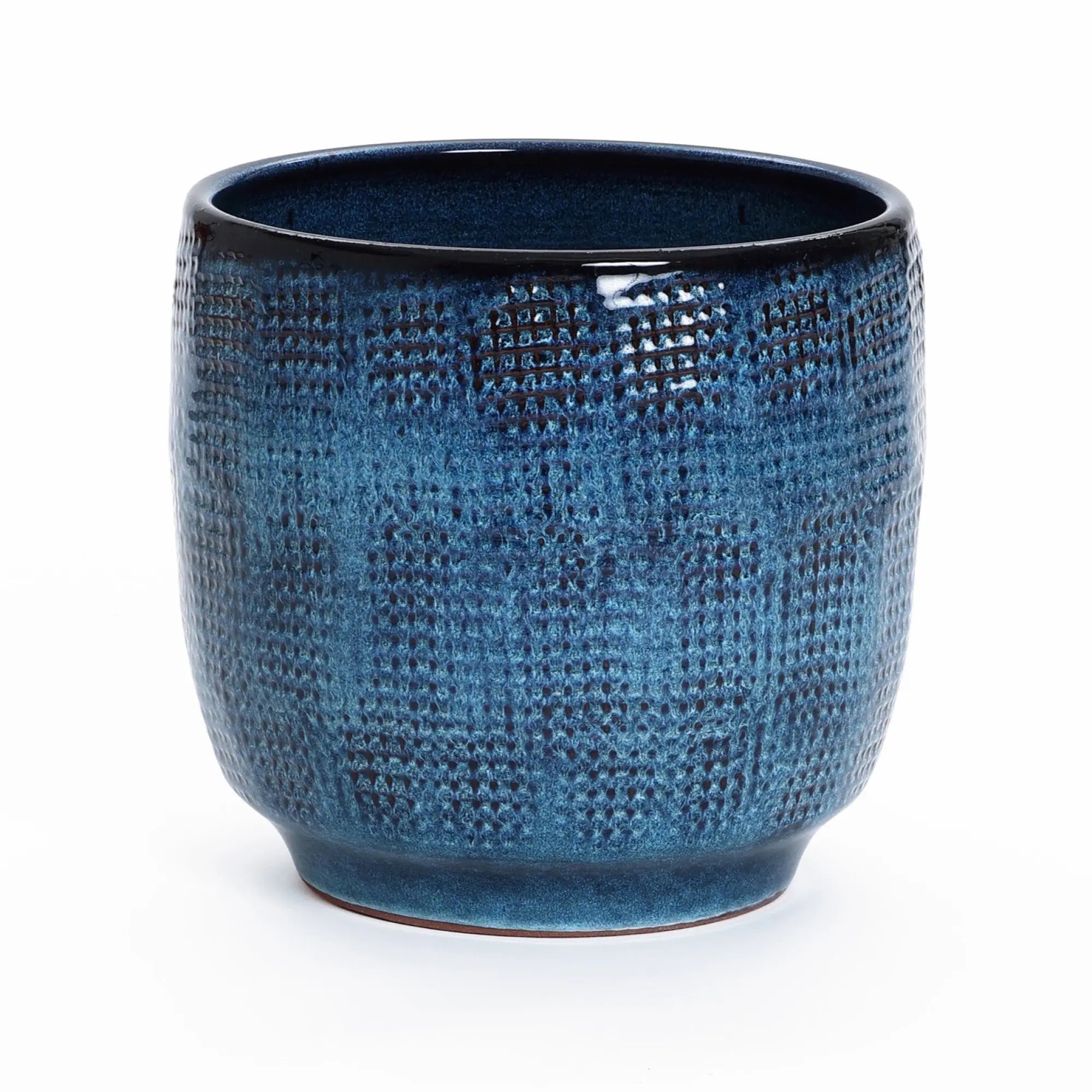 The LuxenHome Ocean blue glazed round ceramic planter, standing at 11.22 inches in height, features a textured dark blue finish with a subtle checkered pattern and glossy gradient color, elegantly resting without a handle on a flat white surface.