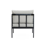 Back view of a cushioned chair with a black metal frame, light gray fabric, and waterproof cushions. Perfectly complements an outdoor armchair set for a stylish patio setup.