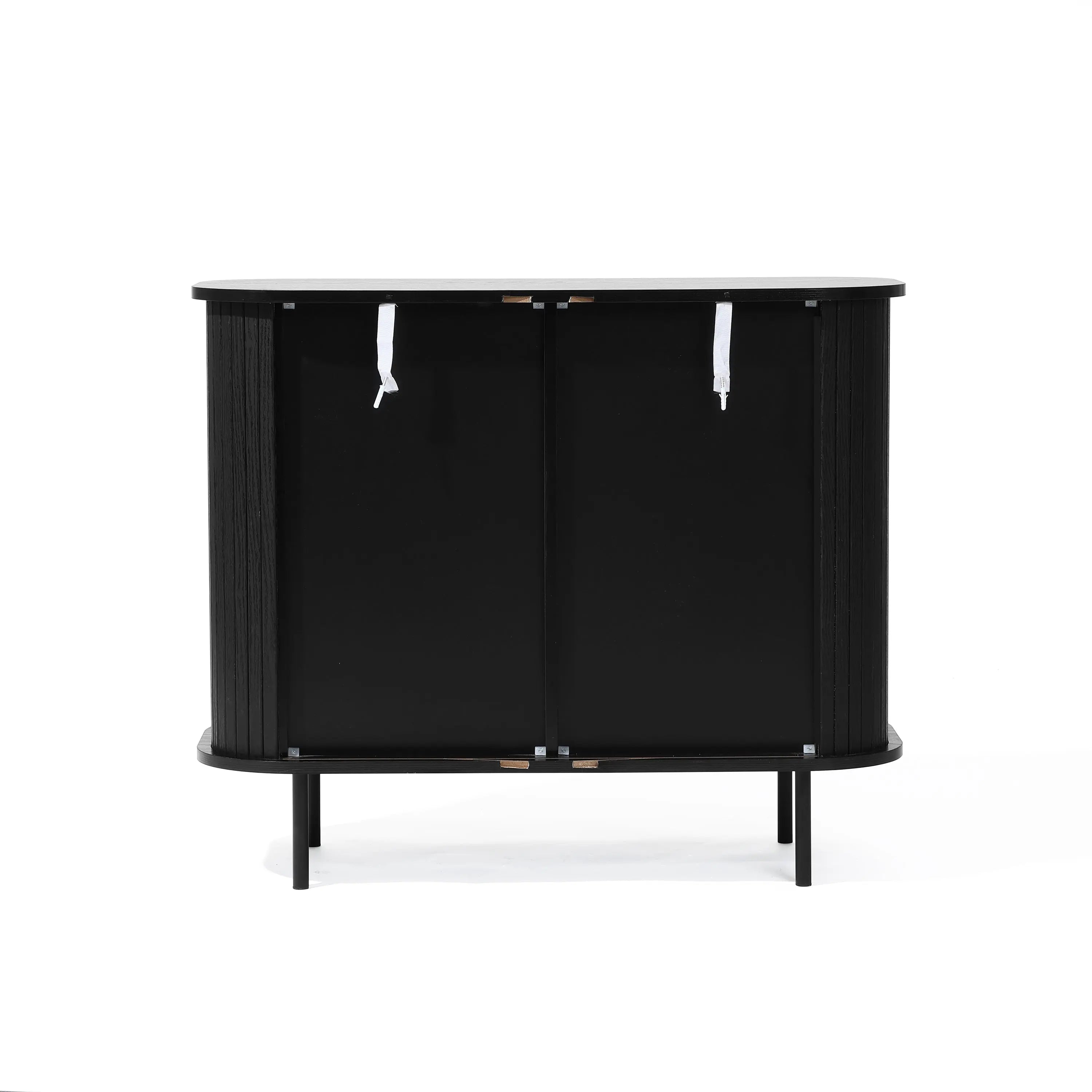 The Aria 2-door tambour accent cabinet by LuxenHome features a sleek black finish, minimalist tambour doors, and sleek handles. It stands on four sturdy legs with a curved edge design, offering a contemporary look inspired by mid-century modern style.