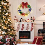 A decorated Christmas living room with a lit fireplace, stockings, an LED-lit holiday wreath, a tree adorned with lights and ornaments, and wrapped gifts.