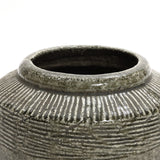 Close-up of the Rustic brown stoneware bowl vase by LuxenHome. This piece has a wide, round opening and a rough ribbed texture in grayish-green, offering an artisanal handmade look, ideal for home decor.